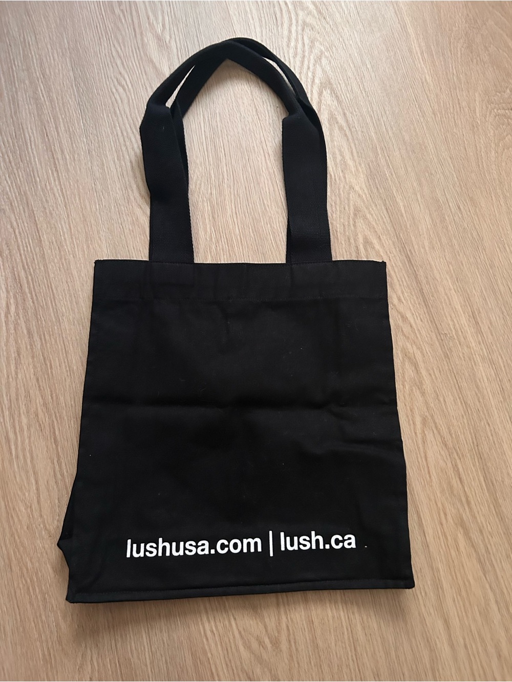 Lush Black Tote Bag with White Graphic